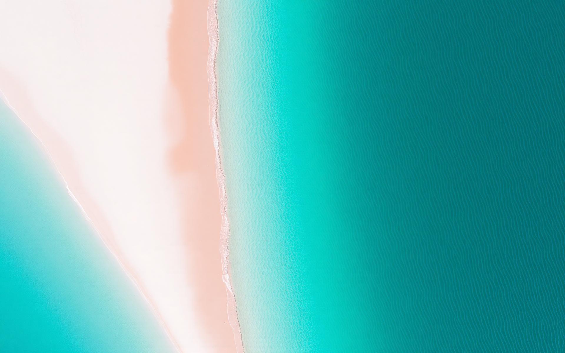 Aerial view of the Western Australian coastline, turquoise shallows meeting white sand.